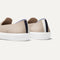 The slip-on Sneaker in Sand shown from the back view with the heel detail.