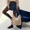 hover | The Bucket Bag in Knot Brown shown on model. 