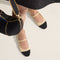 hover | Model wearing The Square Mary Jane in Cream Captoe. 