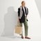 hover | Model holding The Lightweight Tote in Checker Sand.
