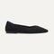 side | The Point II in Black Bouclé shown from the side. 