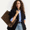 hover | The Classic Tote in Toasty Cat, worn over the shoulder by a model, shown from the side.