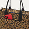 A closeup of The Classic Tote in Toasty Cat, focusing on the exterior zip pocket. 