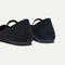 Close up of the heel of The Max Square Mary Jane in Black, with Rothy's signature blue halo.