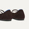 Close up of the heel of The Double Buckle Mary Jane in Chocolate Mesh, with Rothy's signature blue halo.