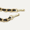 A close-up of The Crossbody Strap in Black Chain, focusing on the end snap hooks and sliding buckle.