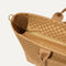 A close up of The Zip Travel Tote in Hazelnut focusing on the zip closure and handles.