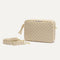 The Crossbody Camera Bag in Sesame shown by itself with removable strap. 