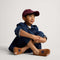 model | Alternate view of a model wearing The Kids Clog in ReVelvet™ Butterscotch Burst. 