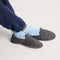 hover | Model wearing The Teddy Men's Slipper in Newsprint.