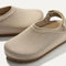 Close up of the rounded topline of The Kids Clog in Dove. 