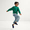 model | An alternate image of a model wearing The Kids Clog in Deep Navy. 
