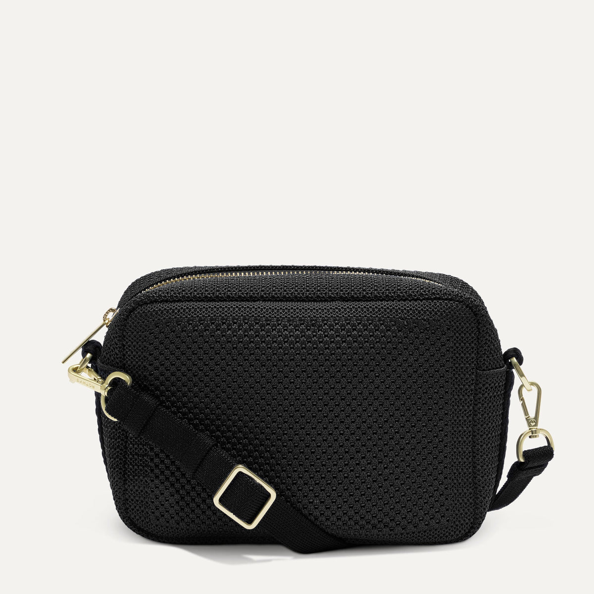 PDP |The Crossbody Camera Bag in  Black Licorice Open-Knit, shown from the front. 