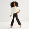 model | An alternate image of a model wearing The Kids Big Bow Mary Jane in Conch.
