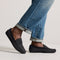 hover | Model wearing The Men's Driver in Carbon Herringbone. 