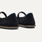 Close up of the heel of The Cruiser Mary Jane in ReVelvet Black, with Rothy's signature blue halo. 