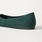 Close up of the heel of The Almond Ballet in ReVelvet Evergreen Captoe, with Rothy's signature blue halo. 