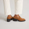 hover | Model wearing The Block Heel Loafer in ReVelvet Caramel. 