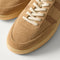 Close up of the toe and stitching details of The Men's Court Sneaker in ReVelvet™ Pecan.