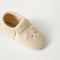 Close up of the toe and vamp of The Baby Moc in Frosted Teddy.