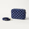 The Crossbody Camera Bag in ReVelvet™ Blue Ink shown by itself with removable strap. 